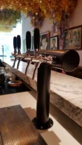 4 beer taps on matt black T-bar tower