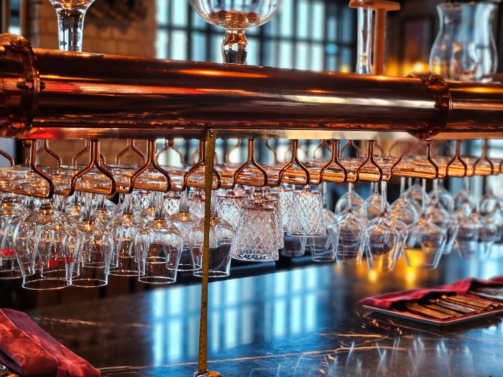 Brauhaus designed copper coated glass rack at Belga, Sofitel Bangkok