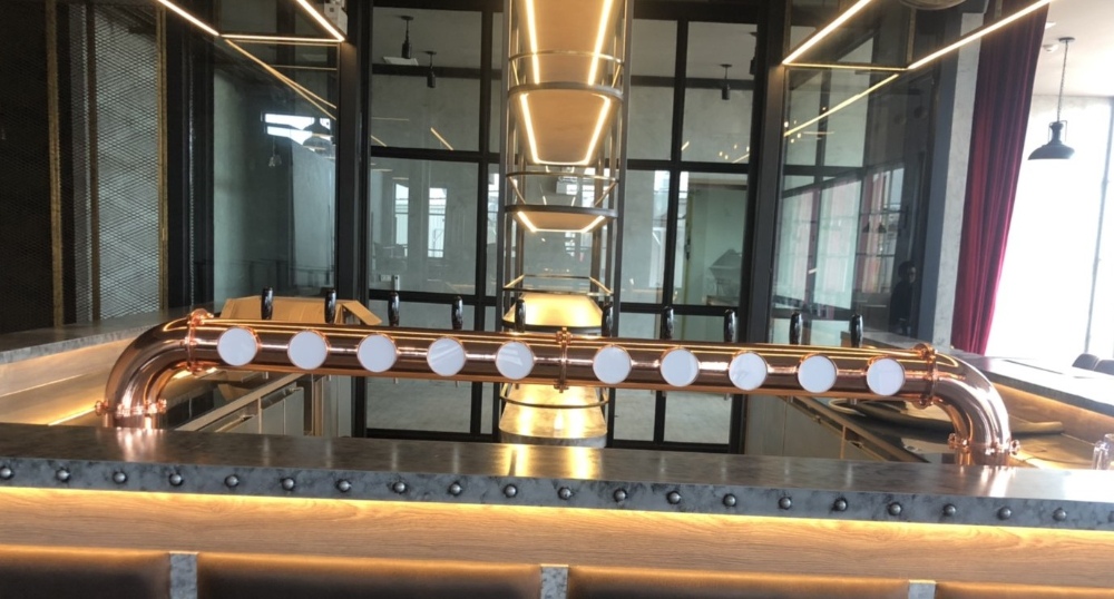 Low 10 beer taps on copper bridge at golf club